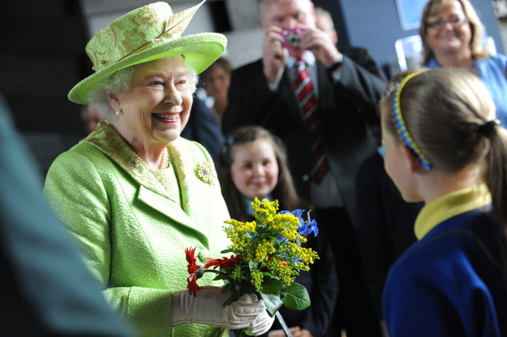 Calls for a forgotten royal tradition to return Queen Elizabeth II shows her style in a green hat and coat dress