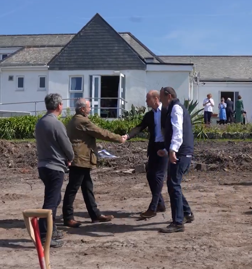Prince William, The Duke of Cornwall, is invited to dig part of the foundations for a hospital extension in the Scilly Isles