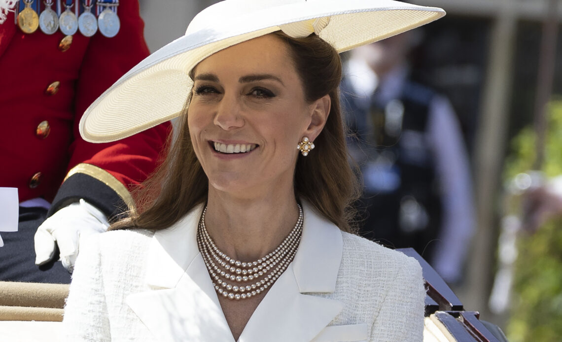 The Princess of Wales in white with pearl jewellery at the Order of the Garter service. She took part in a carriage procession following the service.