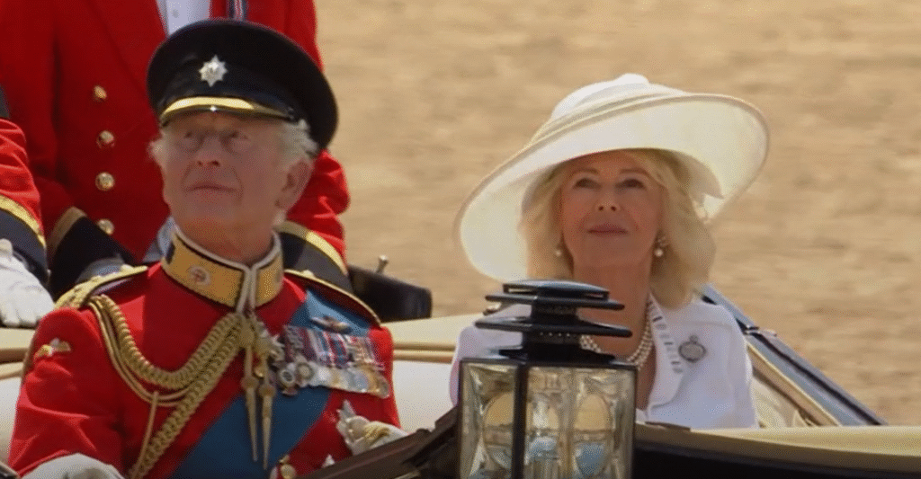 The King and Queen greet crowds as they leave Trooping the Colour. Queen Camilla wears a brooch that belonged to Queen Elizabeth II.