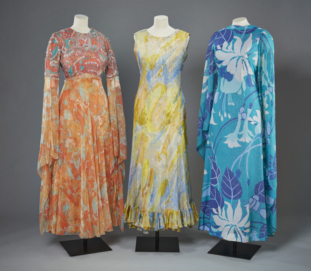 Brightly coloured evening gowns in red, yellow and blue, designed by Ian Thomas for Queen Elizabeth II in the 1970s