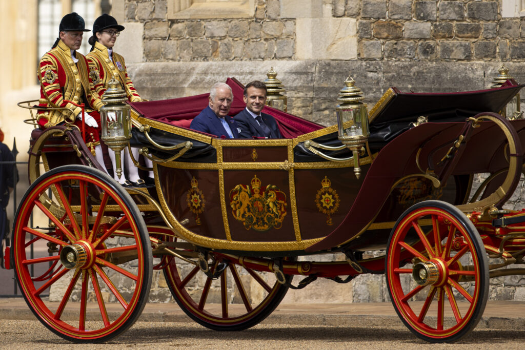 King Charles and Emmanuel Macron arrive at Windsor Castle in the 1902 State Landau at the start of the State Visit to the UK