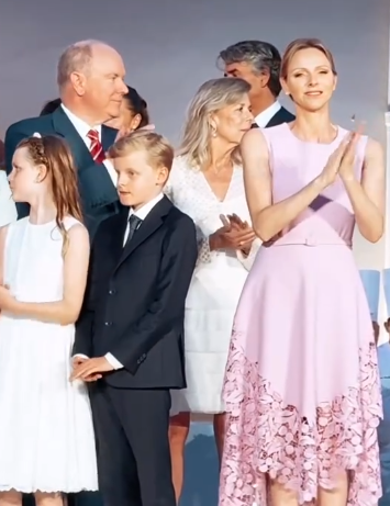 Princess Charlene applauds at celebrations for the 20th anniversary of the reign of her husband, Prince Albert II of Monaco
