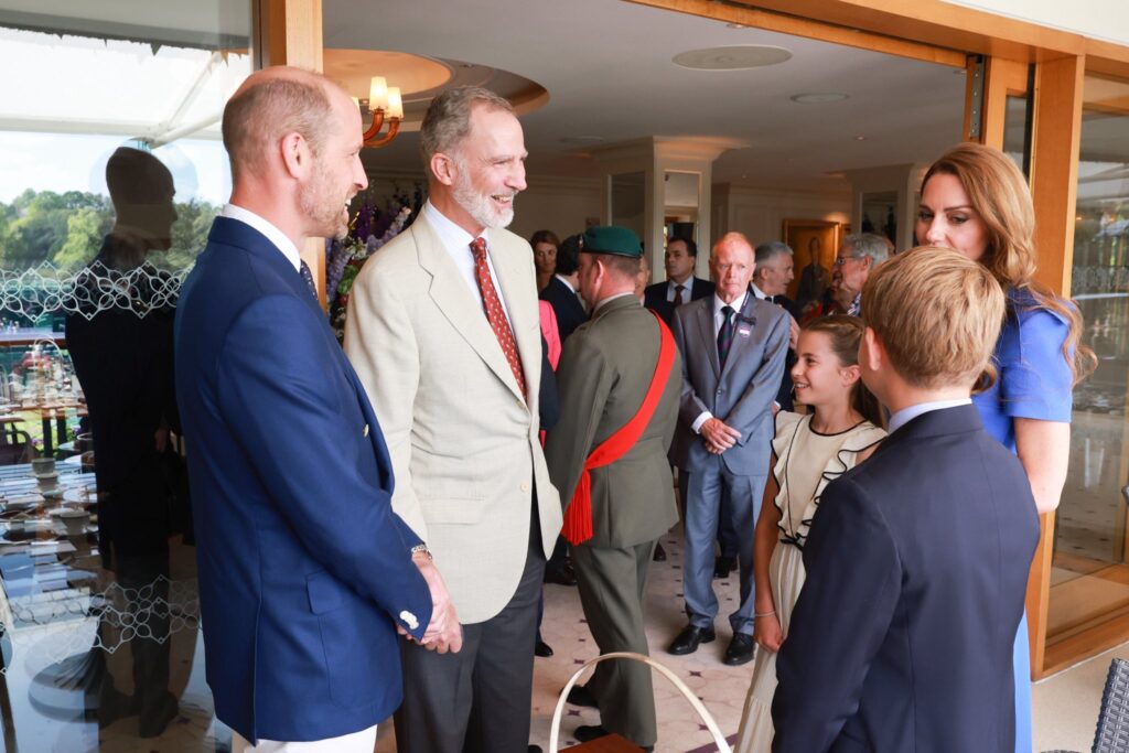 King Felipe of Spain chats with the Prince and Princess of Wales, Prince George and Princess Charlotte at Wimbledon
