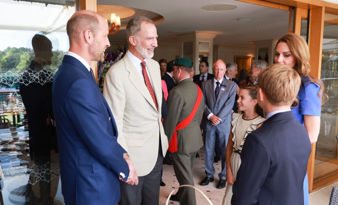 King Felipe of Spain chats with the Prince and Princess of Wales, Prince George and Princess Charlotte at Wimbledon