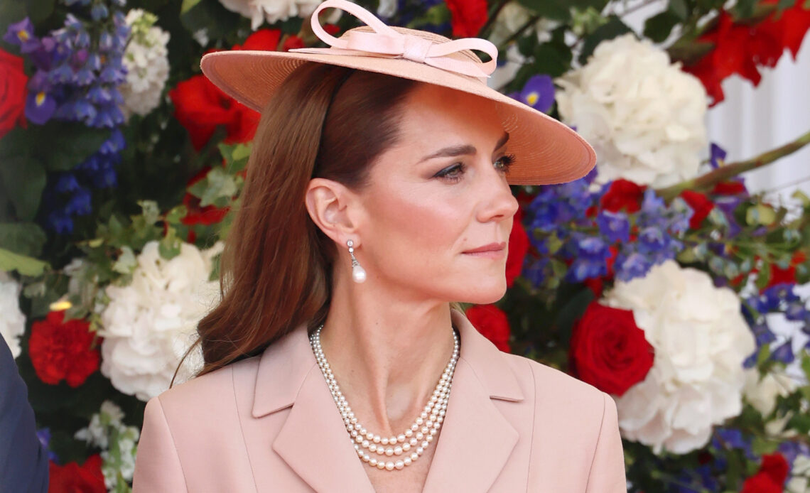 The Princess of Wales in a bar jacket by Dior and a 1940s style hat by Jess Collett at the official welcome ceremony for the State Visit of the President of France