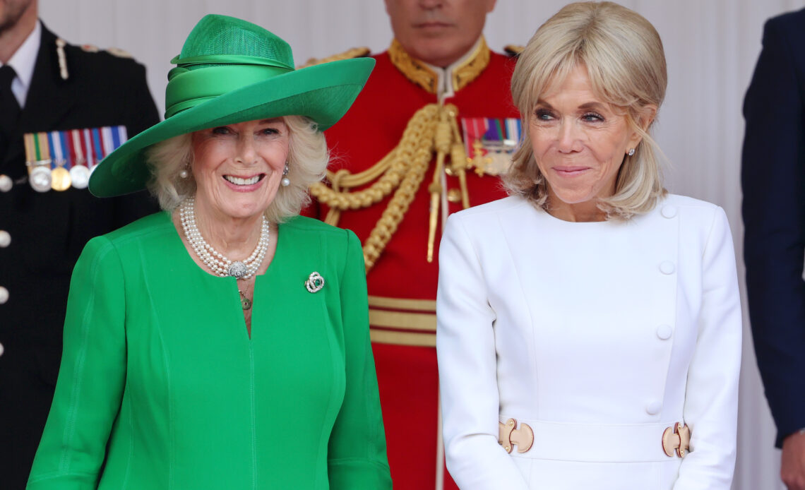Queen Camilla and Brigitte Macron smile and chat at the start of the French State Visit to the UK. Queen Camilla wore bright green while Mrs Macron is in white.