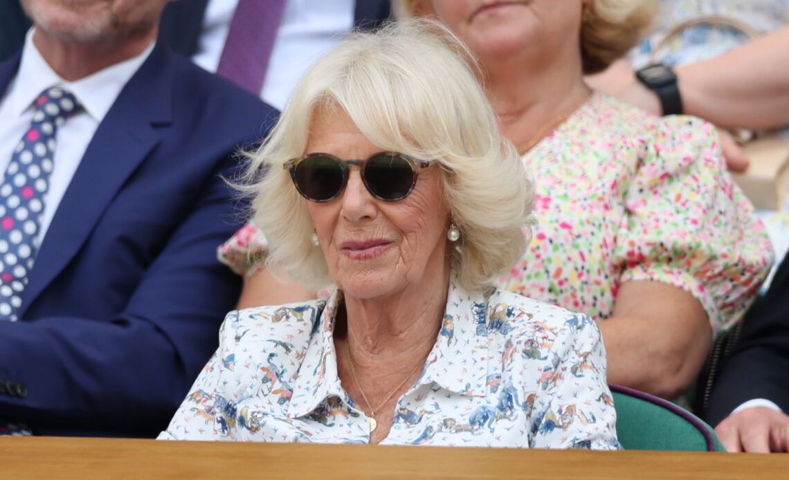 Queen Camilla wears sunglasses as she watches Wimbledon from the royal box where she was joined by Peter Phillips and his partner, Harriet Sperling, whose royal romance was given another seal of approval.