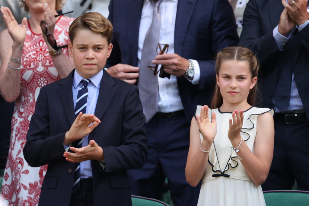 Prince George and Princess Charlotte take their seats in the royal box at Wimbledon having met British doubles champs, the first all British pair to win the title since the reign of Edward VIII.