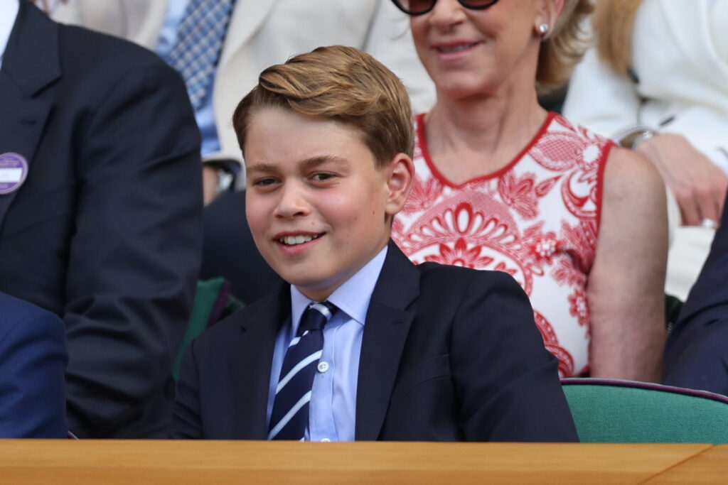 Prince George watches the Men's Singles Final at Wimbledon where the last king called George once played in the doubles