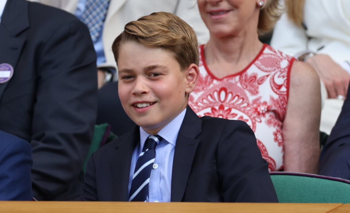 Prince George watches the Men's Singles Final at Wimbledon where the last king called George once played in the doubles
