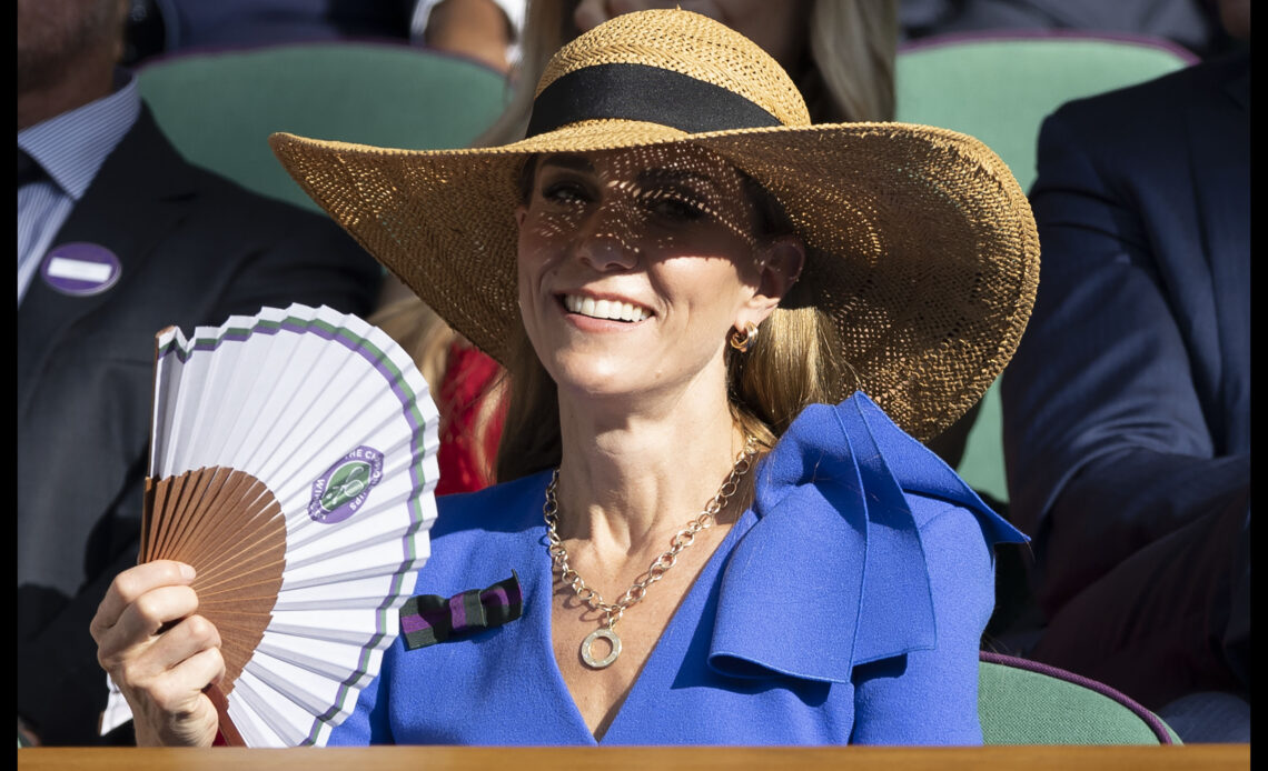 Kate, The Princess of Wales fans herself during the Men's Singles Final at Wimbledon.