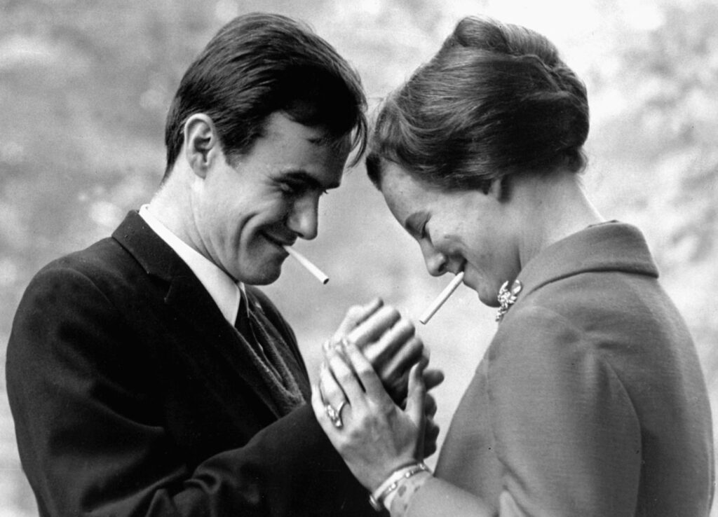 Prince Henrik lighting a cigarette for Margrethe, 1966