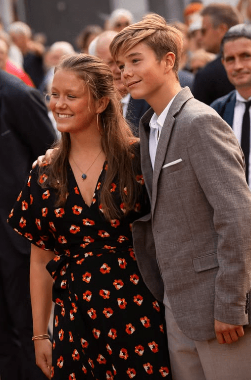 Princess Isabella and Prince Vincent of Denmark hug as they greet crowds in Grasten