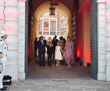 Princess Charlene arrives for a celebration for the anniversary of her husband's reign which included a giant red and white cake
