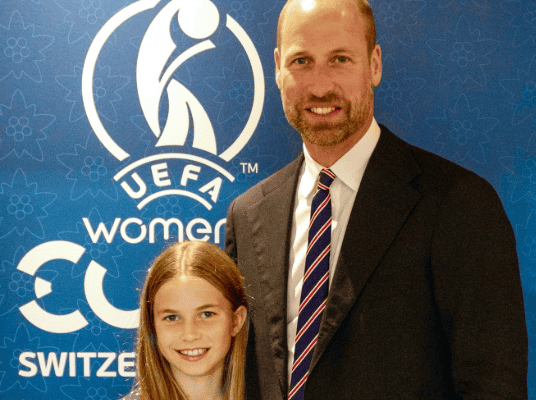 Princess Charlotte and her dad, Prince William, hug as they arrive at the finals of the Euros 2025