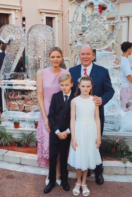 Prince Albert, Princess Charlene, Prince Jacques and Princess Gabriella of Monaco. Princess Charlene wears pink for a big party.