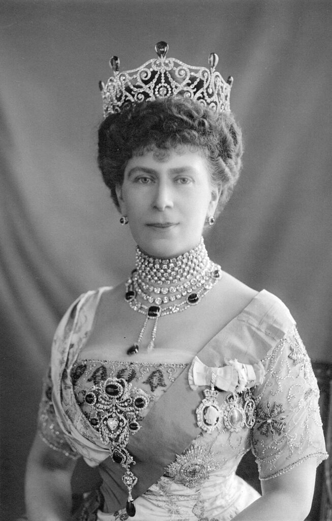 Queen Mary wears the delhi Durbar tiara with emeralds, the jewel she wore in stead of a crown when she was celebrated as Empress of India.