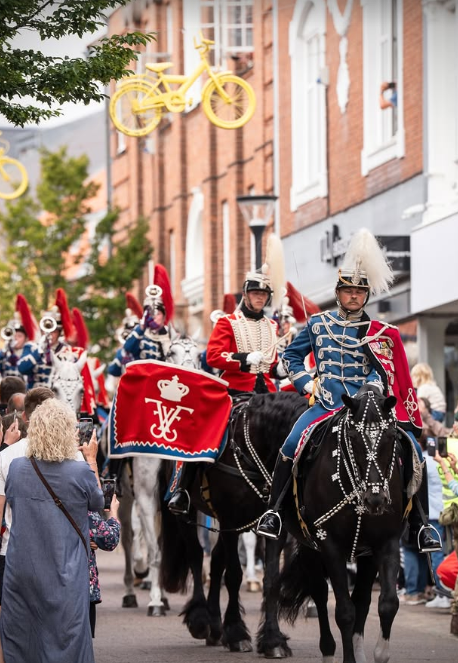 a group of men in military uniforms riding horses