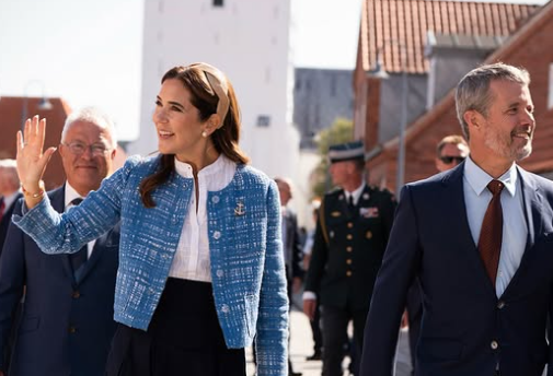 Queen Mary shows she is the champion of sustainable fashion as she rewears a blue Prada jacket 12 years after its first showing