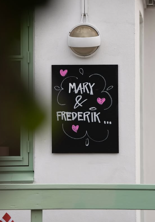 A sign reading Mary and Frederik and surrounded by pink hearts which was put out for the King and Queen of Denmark during their summer tour