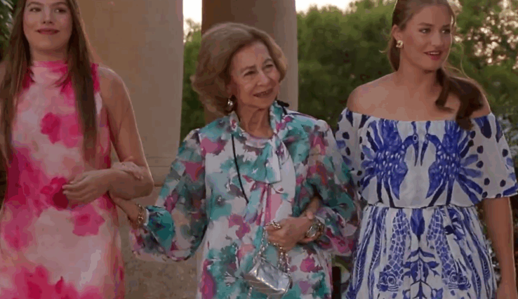 Queen Sofia of Spain walks arm in arm with her granddaughters, Princess Leonor and Infanta Sofia, at Marivent Palace
