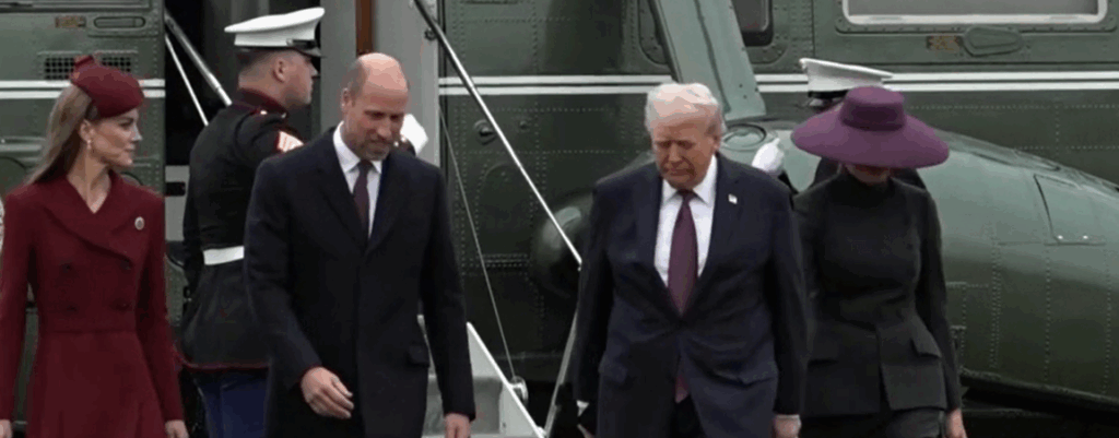 Donald Trump holds hands with Melania Trump as they leave Marine One at the start of their State Visit and walk across the lawn at Windsor Castle with the Prince and Princess of Wales.