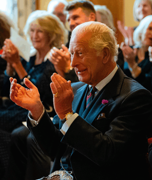 King Charles applauds during the recording of a radio programme at Balmoral