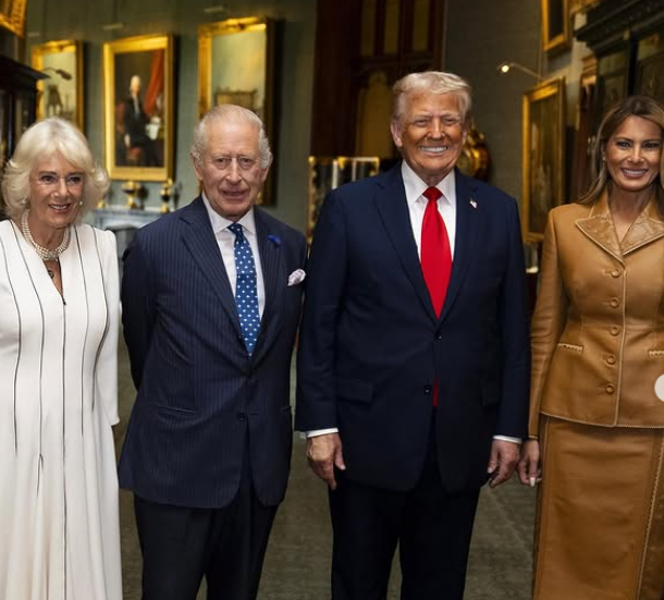 King Charles and Queen Camilla pose with the Trumps in a corridor at Windsor Castle