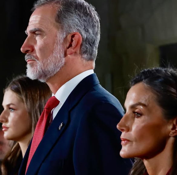 King Felipe, Queen Letizia and Princess Leonor stand in profile