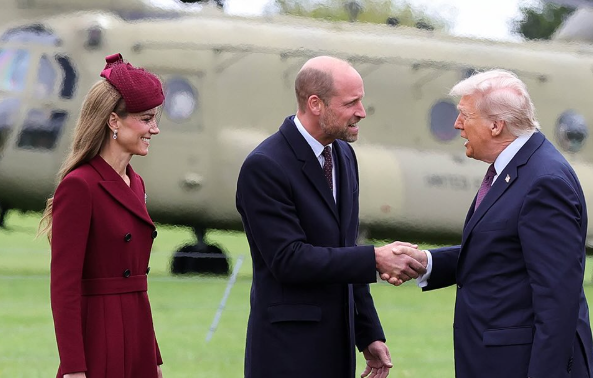 The Prince of Wales shakes hands with Donald Trump while the Princess of Wales smiles at the US President