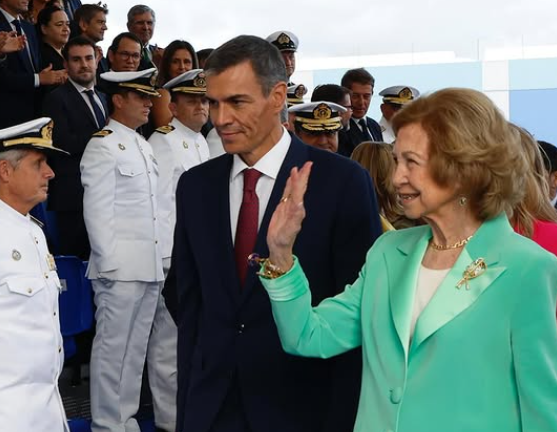 Queen Sofia of Spain in green with a gold brooch