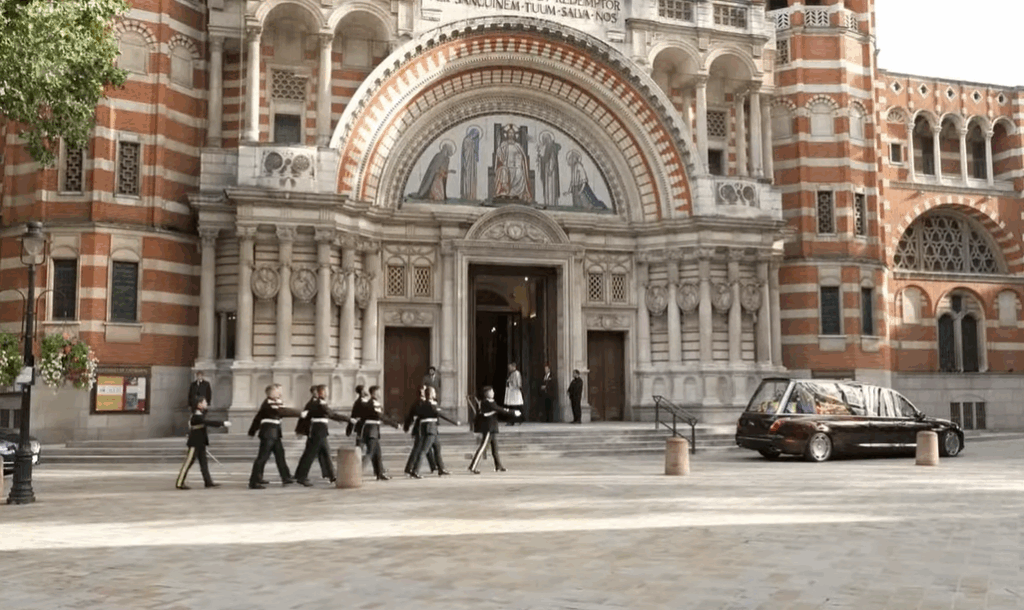A bearer party of the Royal Dragoon Guards marches towards the Royal Hearse at Westminster Cathedral for the reception of the coffin of the Duchess of Kent