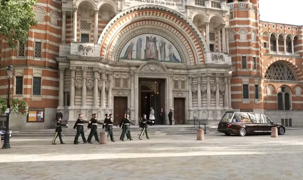 A bearer party of the Royal Dragoon Guards marches towards the Royal Hearse at Westminster Cathedral for the reception of the coffin of the Duchess of Kent