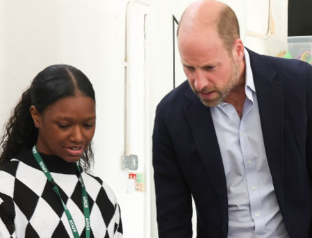 Prince William looks at a camera as he takes part in a film workshop in Lambeth