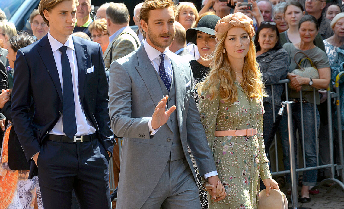 Beatrice Borromeo and her husband, Pierre Casiraghi, walk hand in hand at a wedding where they joined royal relatives from Monaco