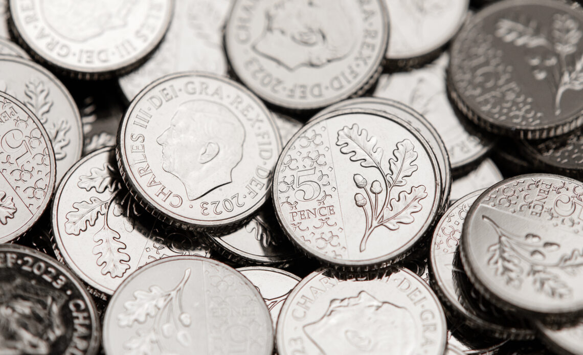 A pile of 5p coins bearing the image of King Charles are sent to a Post Office, a royal first