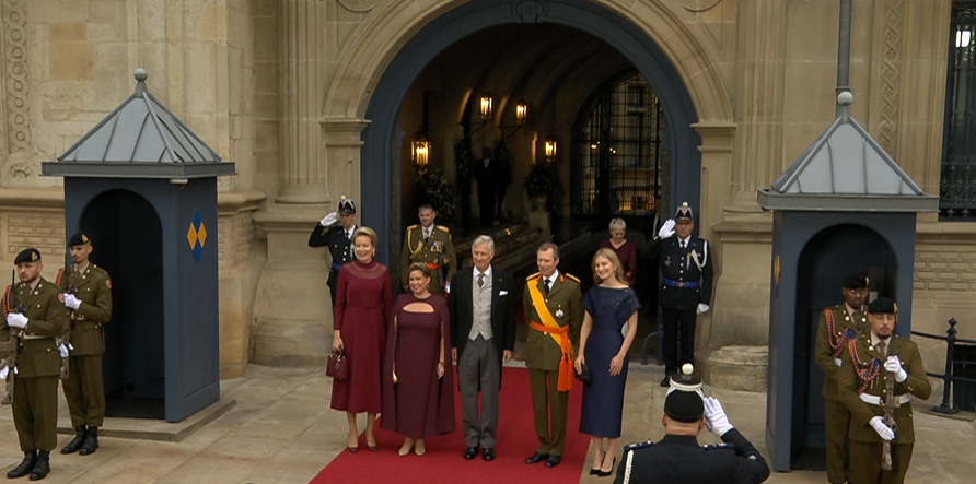 King Philippe, Queen Mathilde and Princess Elisabeth of Belgium stand outside the Grand Ducal Palace in Luxembourg