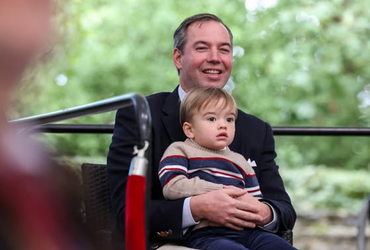 Grand Duke Guillaume cuddles his toddler son, Prince Francois