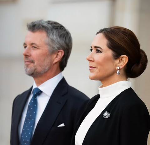 King Frederik and Queen Mary look into the distance as they wait for European political leaders to arrive at the Amalienborg Palace