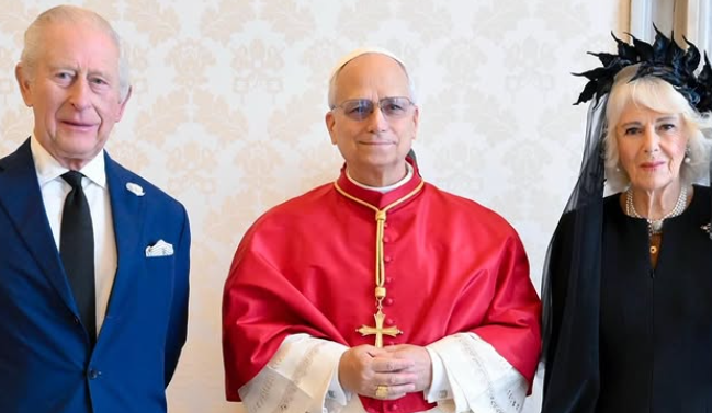 Pope Leo stands in the middle of King Charles and Queen Camilla