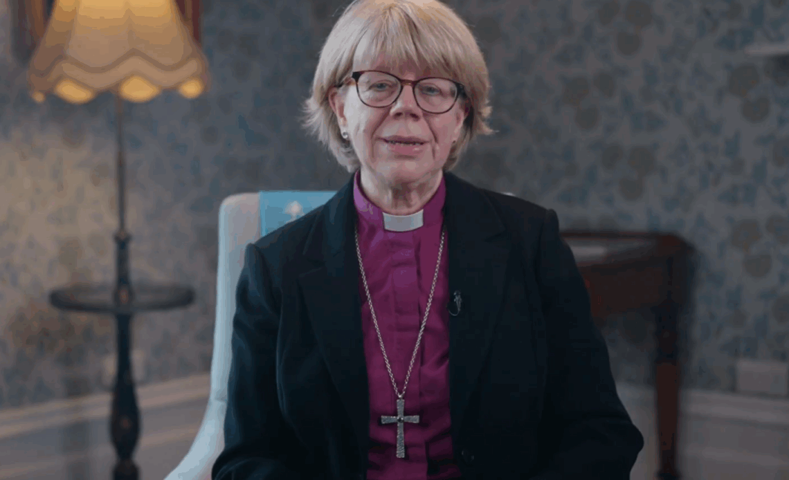 The Bishop of London, Sarah Mullally, sits on a blue chair to announce her appointment as Archbishop of Canterbury