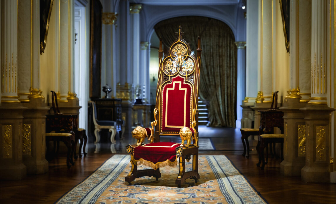 The throne that will be used by Guillaume of Luxembourg when he becomes Grand Duke. It is gold with red velvet cushions and has carved lions on its arms.