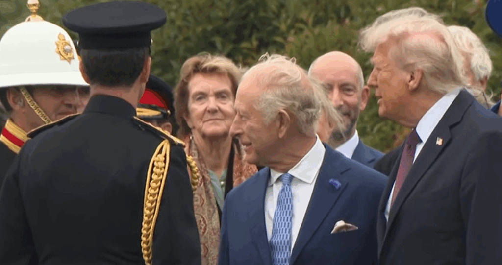 King Charles and Donald Trump both have windswept hair as they meet troops at a Beating the Retreat parade at Windsor Castle