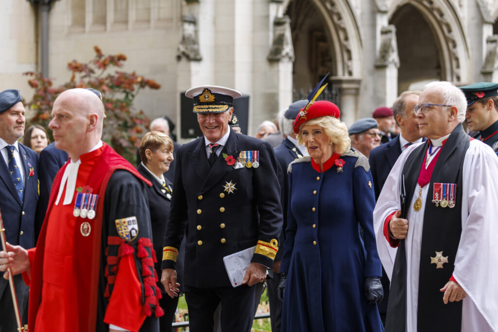 Queen Camilla in a red beret and blue military style coat arrives at the Field of Remembrance