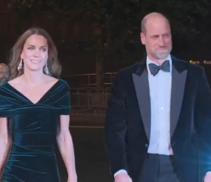 The Princess of Wales wears a green velvet dress and Prince William wears a black velvet jacket