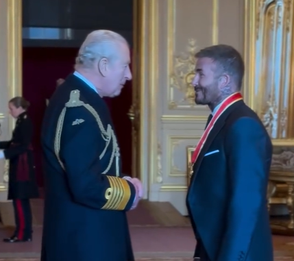 King Charles speaks to Sir David Beckham after knighting him at Windsor Castle