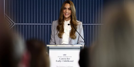 The Princess of Wales wears a pale blue jacket and white ruffle blouse