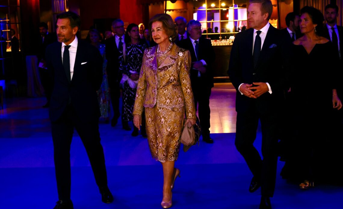 Queen Sofia of Spain wears a gold suit and gold shoes for an arts awards ceremony.