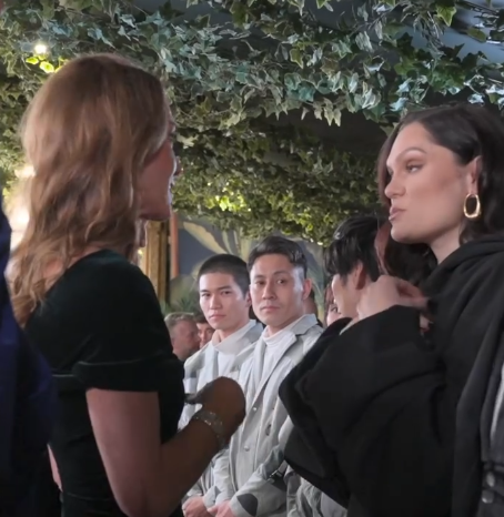 The Princess of Wales talks to singer Jessie J who is wearing a large black coat